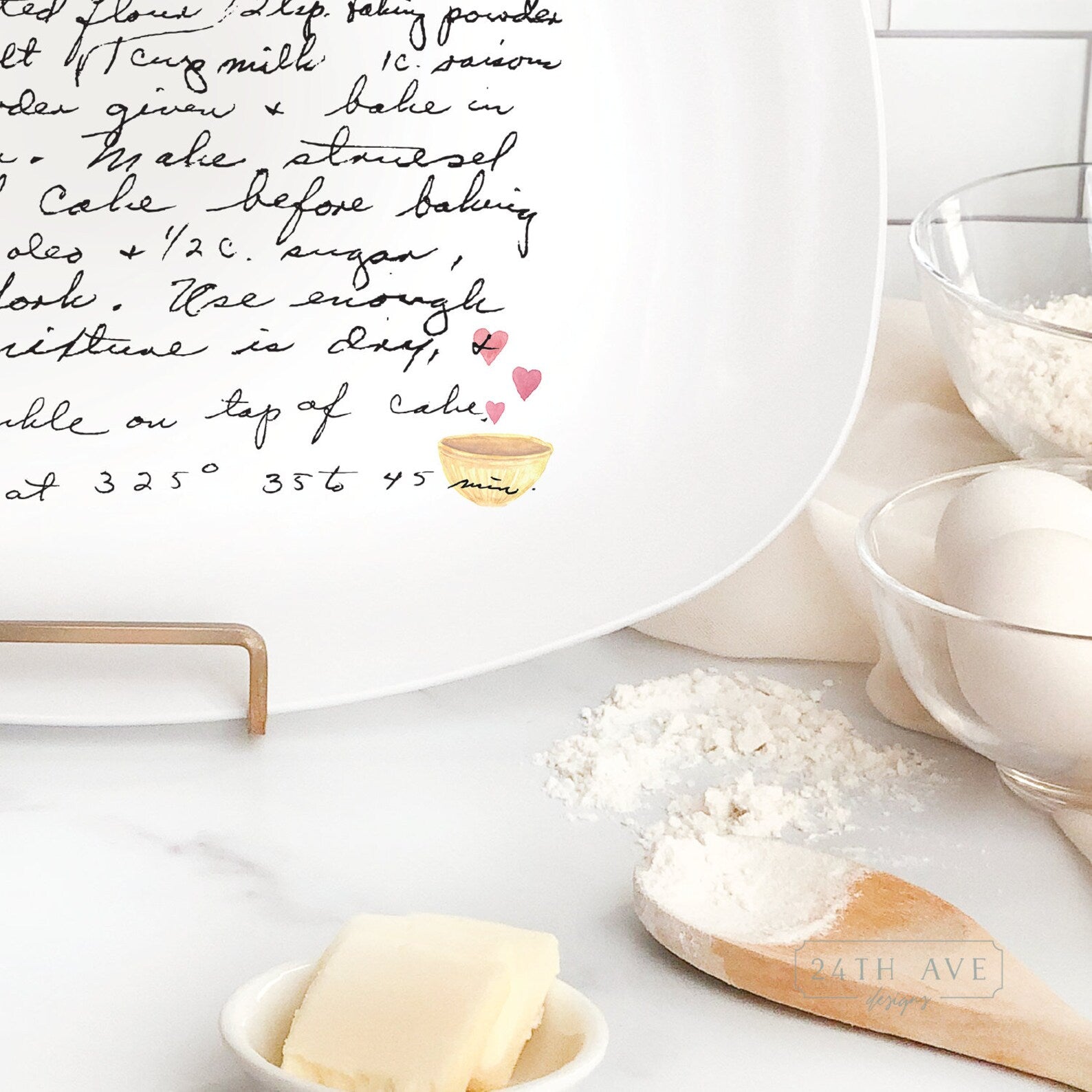 Detail view of handwritten family recipe printed on white serving platter with small heart bowl illustration.