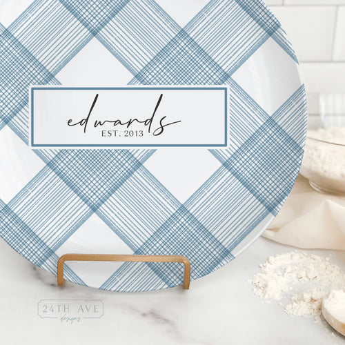 Close up of personalized blue plaid family name plate with established date