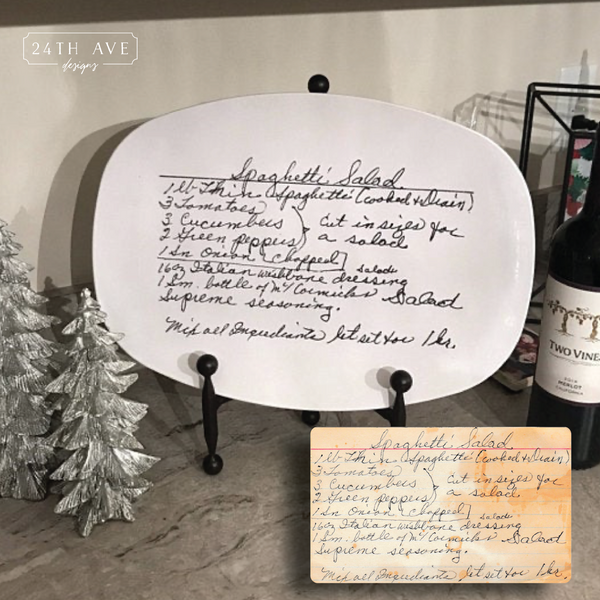 Original handwritten recipe platter displayed on stand with handwritten recipe card for comparison